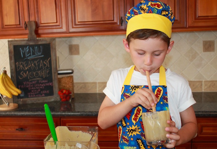 boy drinking breakfast smoothie