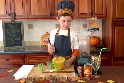 boy stirring pumpkin