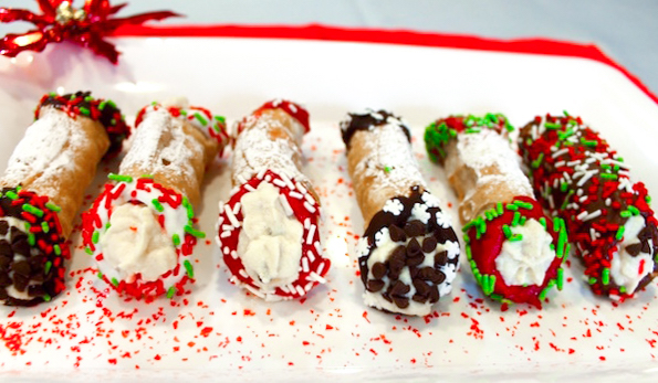 christmas cannolis decorated with chocolate and sprinkles