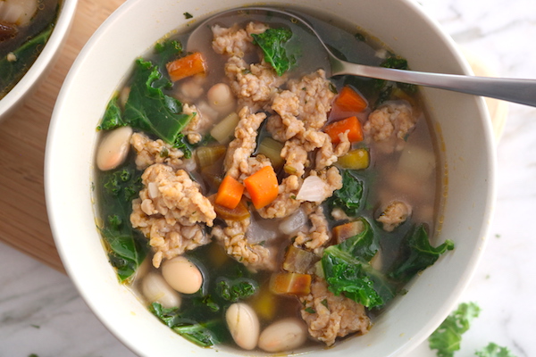 chicken sausage soup white bean and kale close