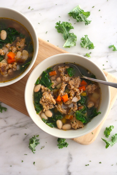 turkey sausage white bean and kale soup on board