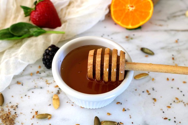 honey in a white bowl