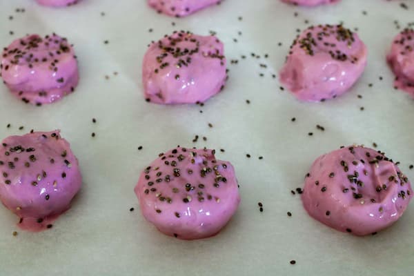 raspberry frozen banana bites on tray