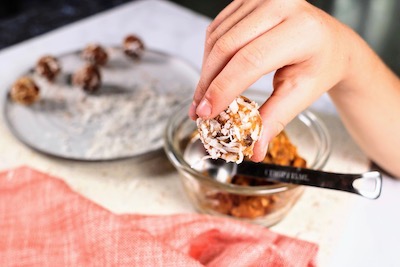 boys hands holding pumpkin protein ball