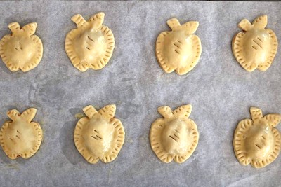 mini apple hand pies on cookie sheet
