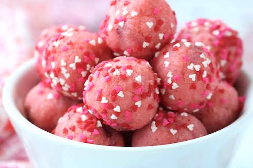 cake balls in bowl with heart sprinkles