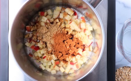 apple pie oatmeal ingredients placed in pot