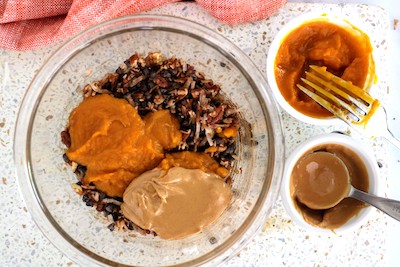pumpkin protein balls ingredients in bowl with pumpkin on top