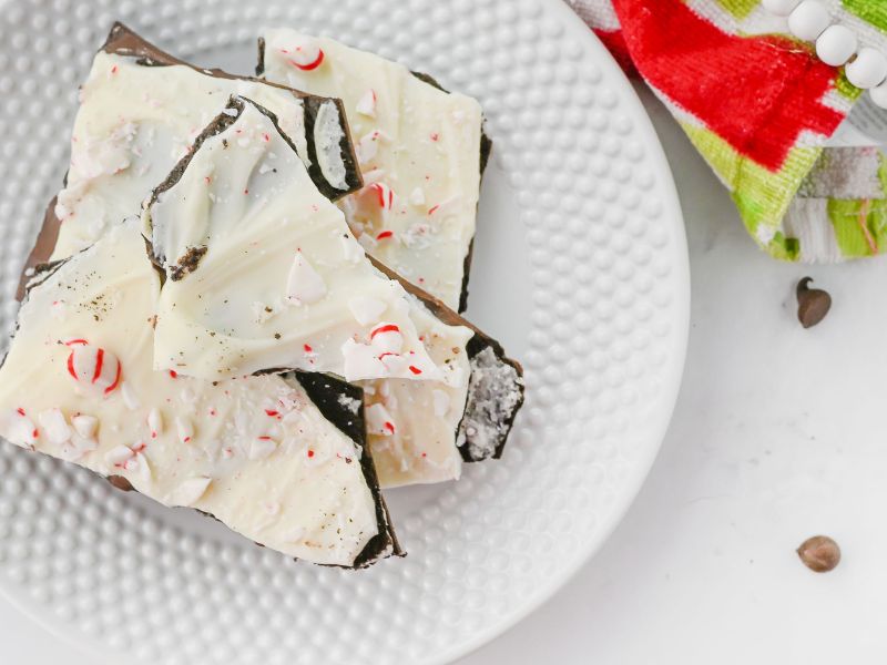 overhead shot of candy cane peppermint chocolate bark on a plate - horizontal view