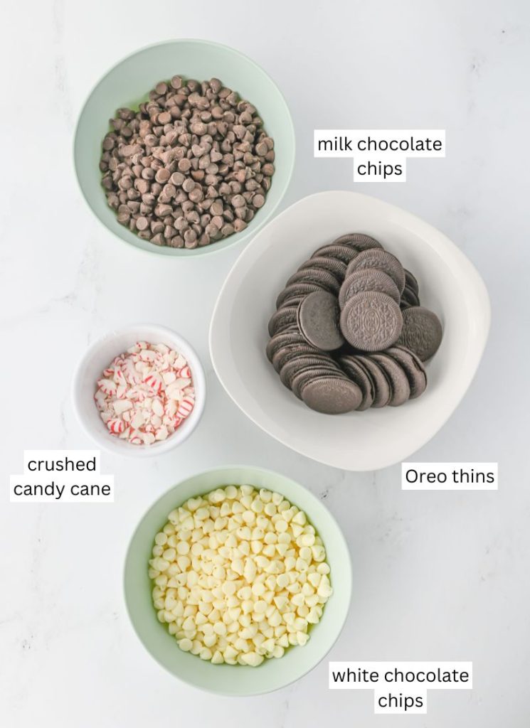 chocolate peppermint bark with oreos and candy cane - overhead of ingredients