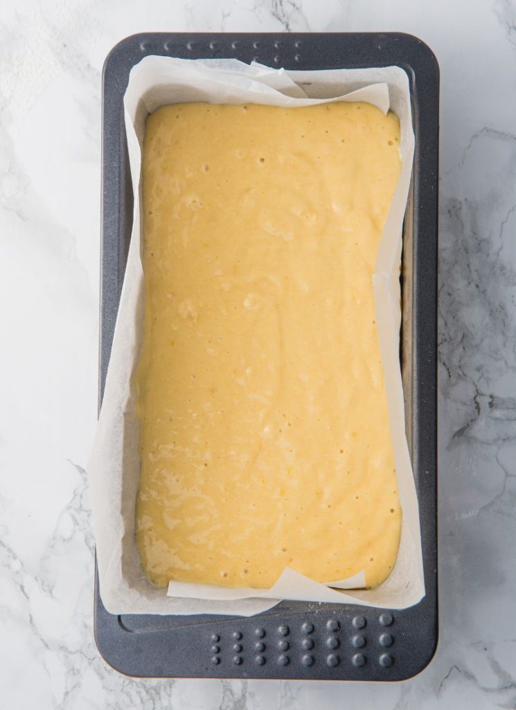 lemon olive oil cake batter in lined tin ready for oven