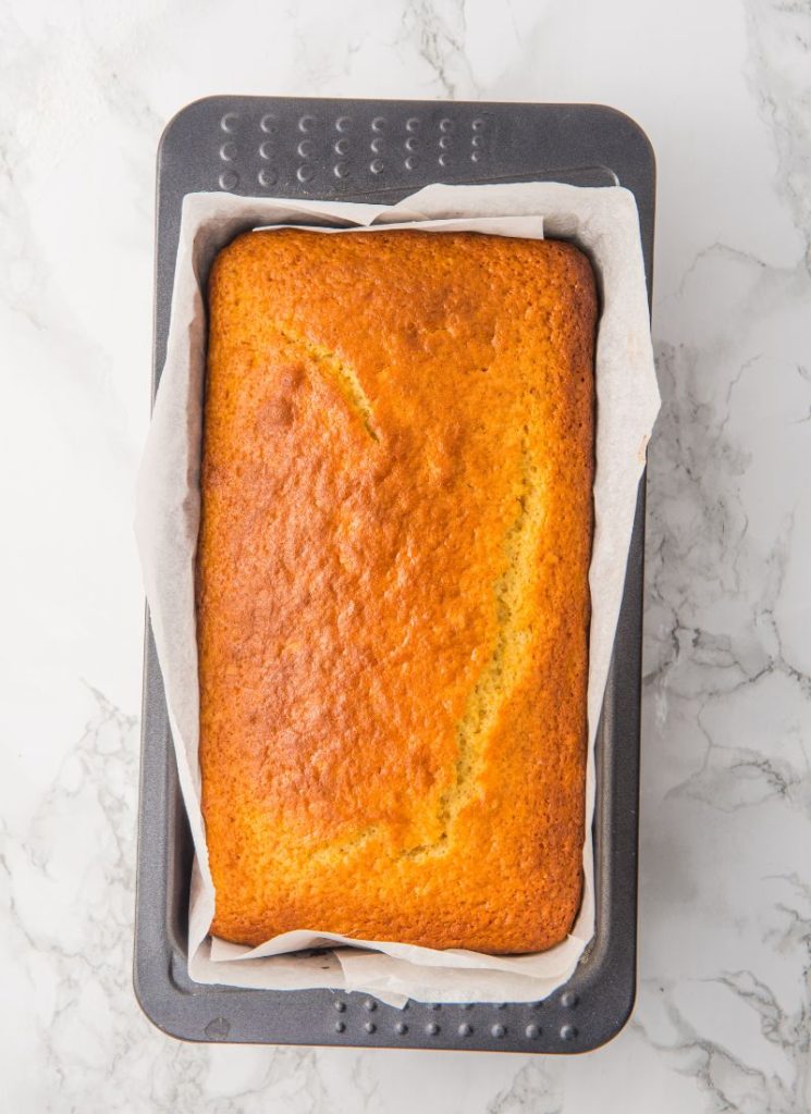 baked lemon cake cooling in tin