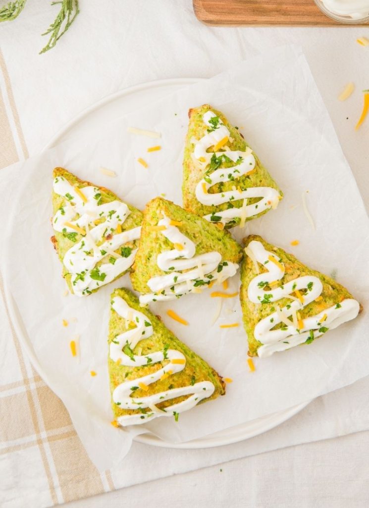 Plate of festive tree-shaped scones baked with cheese and spinach